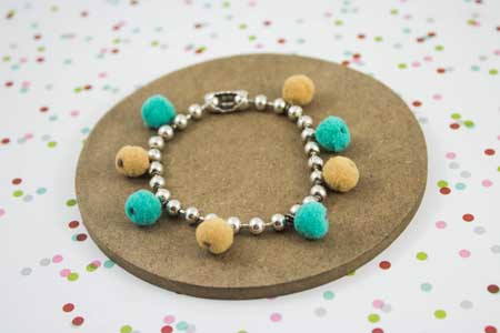 Pulsera pompones redondos y cadena de bolas 